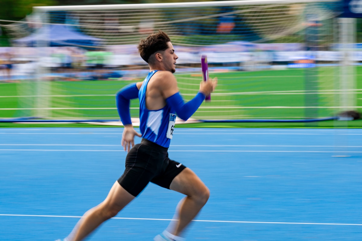 A track athlete sprinting — performance comes from hours of practice.